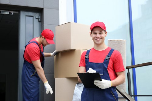 Office relocation planning in West Hampstead with business equipment and moving boxes