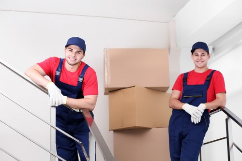 Careful loading of household items into a removal van