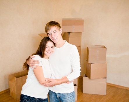 Professional man and van service handling boxes in West Hampstead