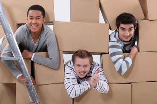 Removal vehicle loading household items for a West Hampstead move