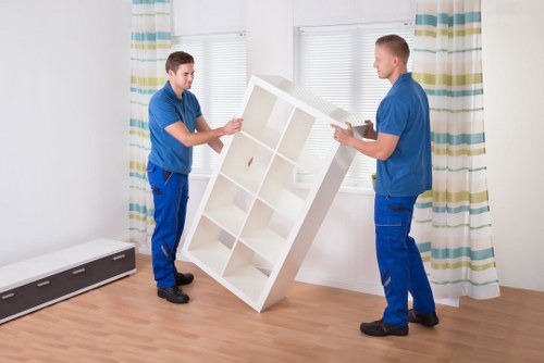 Local moving van handling boxes and household items in West Hampstead