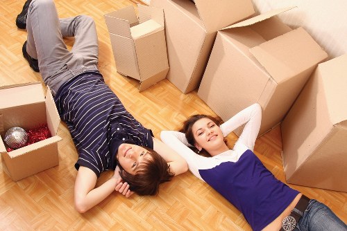 Furniture and cardboard prepared for reuse and recycling during a West Hampstead move